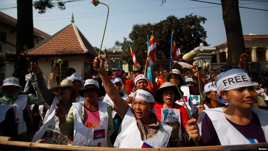 Protesters gather in front of the Appeals Court during a protest near the Royal Palace in central Phnom Penh, Feb. 10, 2014.