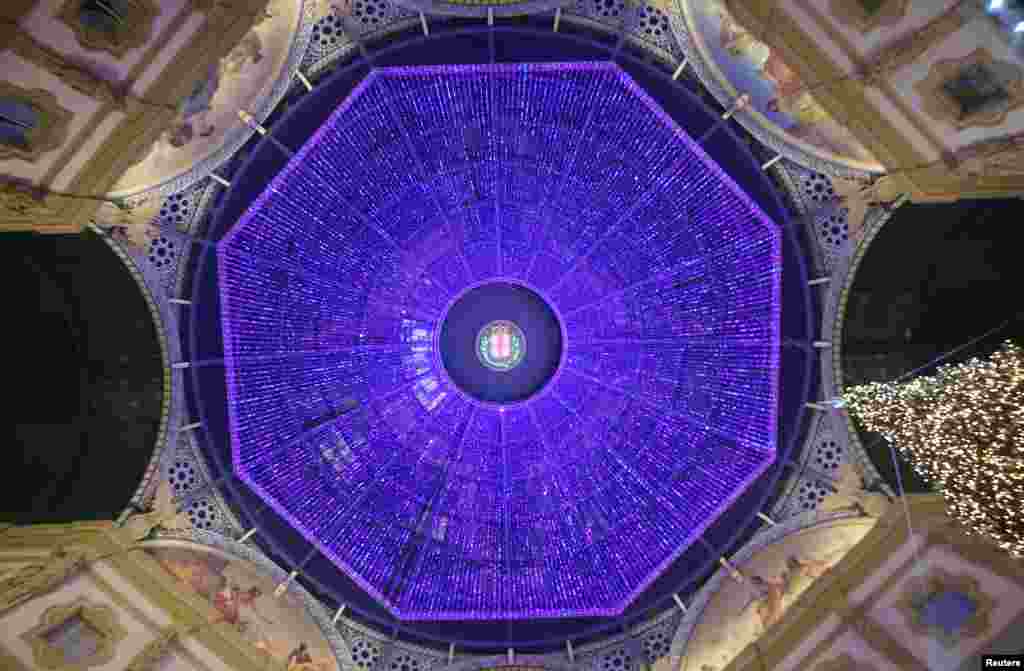 Christmas lights are seen on roof of Vittorio Emanuele II gallery downtown Milan, Italy.