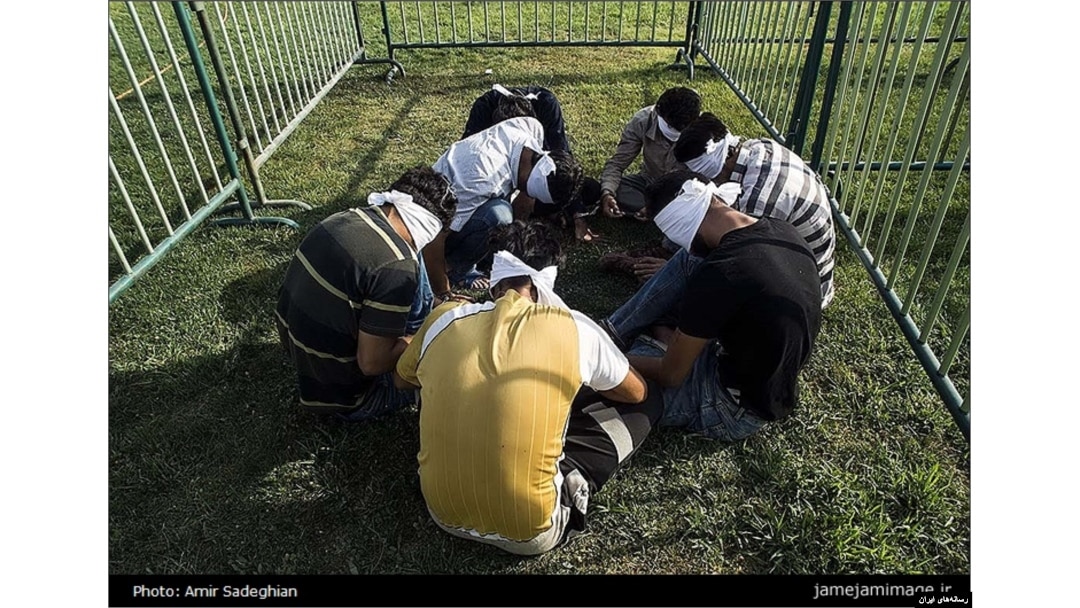 The Afghan government is protesting Iran's decision to blindfold several Afghans and put them in cages.