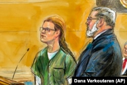U.S. -- In this courtroom sketch, Maria Butina, left, is shown next to her attorney Robert Driscoll, before U.S. District Judge Tanya Chutkan, during a court hearing at the U.S. District Court in Washington, December 13, 2018