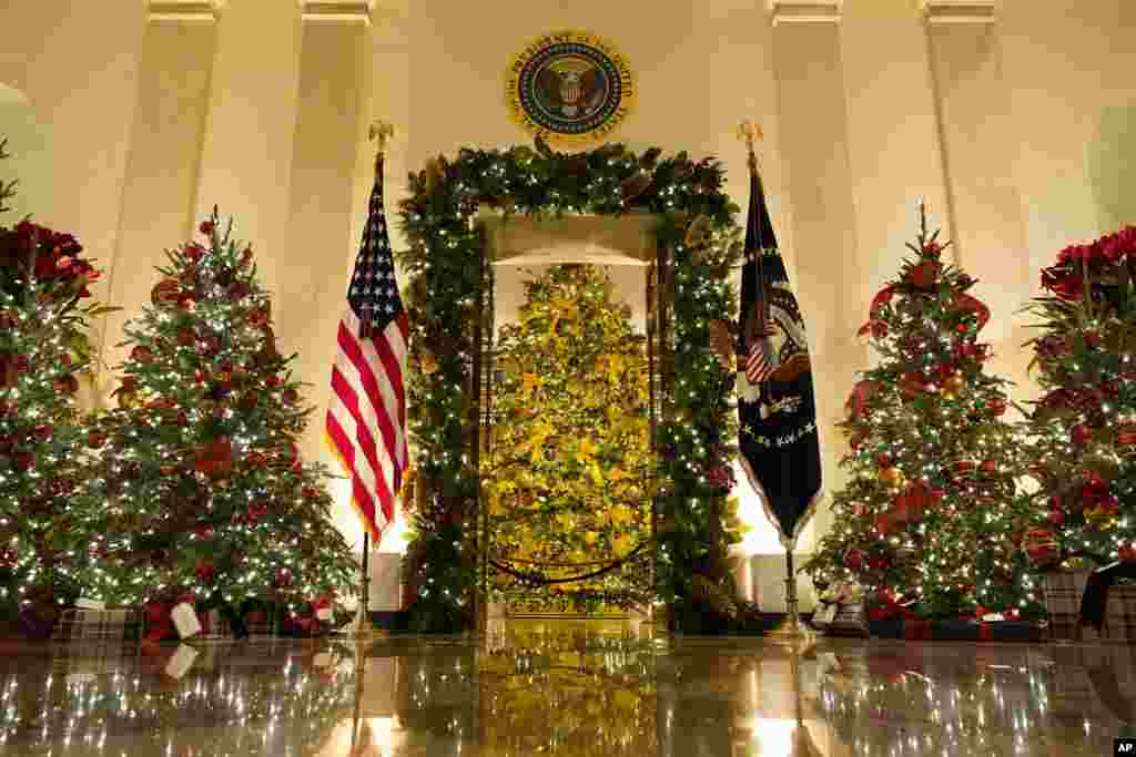 Cross Hall and the Blue Room are decorated during the 2020 Christmas preview at the White House in Washington.