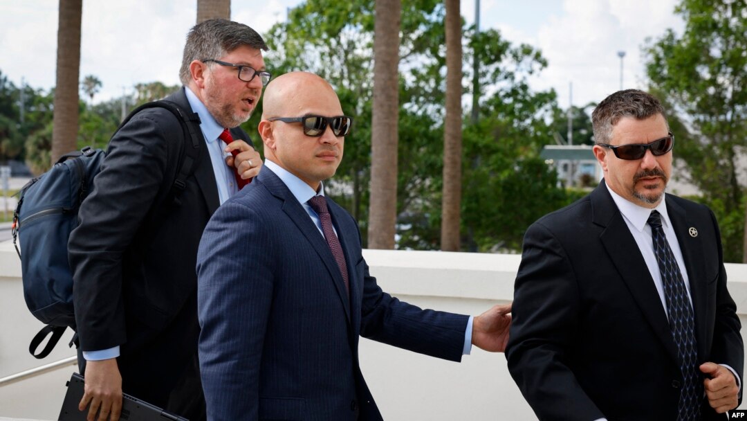 Walt Nauta, center, an aide to former U.S. President Donald Trump and co-defendant in the case regarding allegedly mishandled classified documents, arrives at the courthouse in Fort Pierce, Florida, on May 22, 2024.