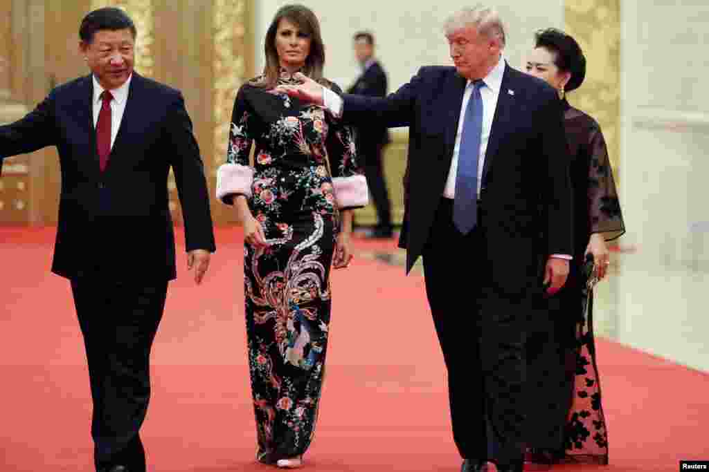 U.S. President Donald Trump and first lady Melania arrive for the state dinner with China's President Xi Jinping and first lady Peng Liyuan at the Great Hall of the People in Beijing.