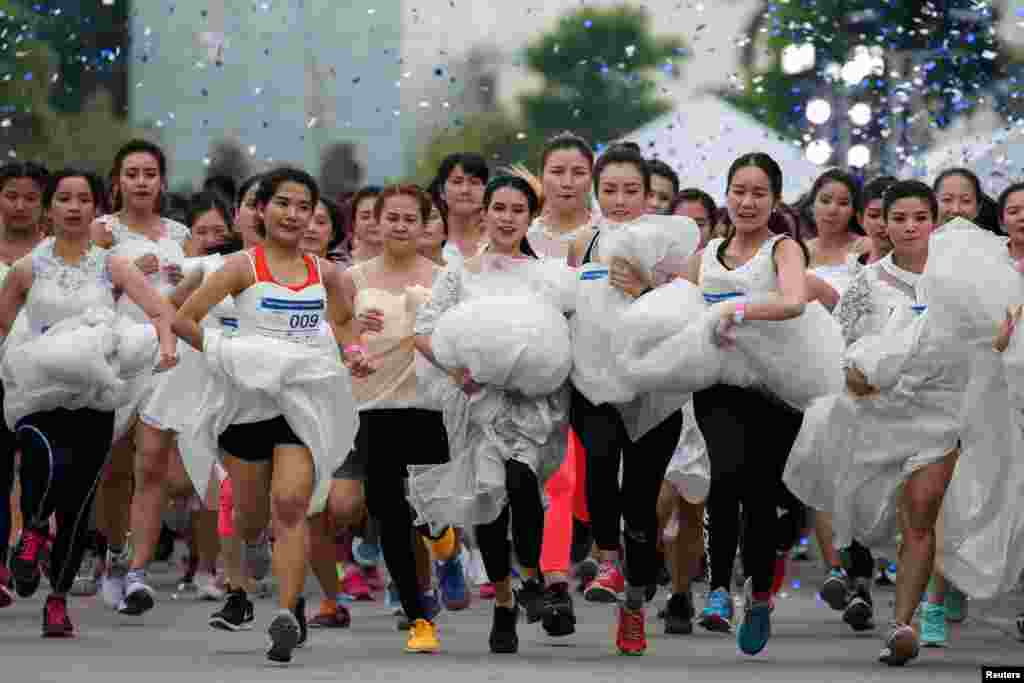 Brides-to-be participate in the "Running of the Brides" race, in Bangkok, Thailand, Dec. 2, 2017.