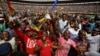 Supporters dance and run on the field after Zimbabwe's President Emmerson Mnangagwa was sworn in at the presidential inauguration ceremony in the capital Harare, Zimbabwe, Nov. 24, 2017.