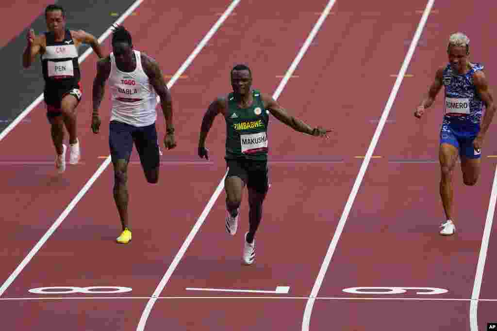Ngoni Makusha, of Zimbabwe, wins a heat in the men's 100-meter run at the 2020 Summer Olympics, Saturday, July 31, 2021, in Tokyo. (AP Photo/Charlie Riedel)