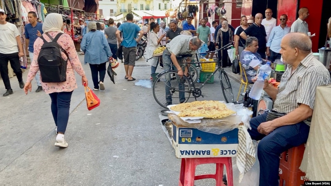 Shoppers in Tunisia's capital. High prices and unemployment have left many struggling.