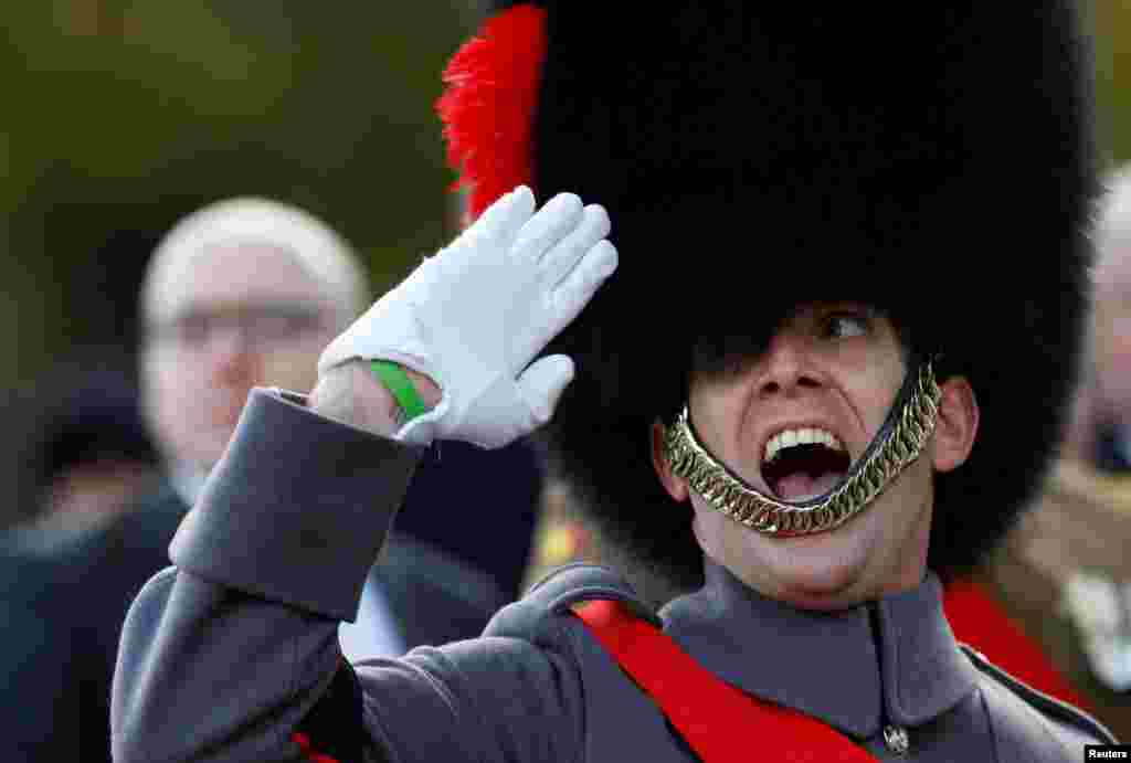 A soldier salutes as he parades past Britain's Prince Edward during the Remembrance Sunday Cenotaph service in London, Britain.