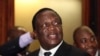 FILE - Zimbabwean Deputy President Emmerson Mnangagwa smiles at the headquarters of ZANU (PF) in Harare, Dec.10, 2014. 