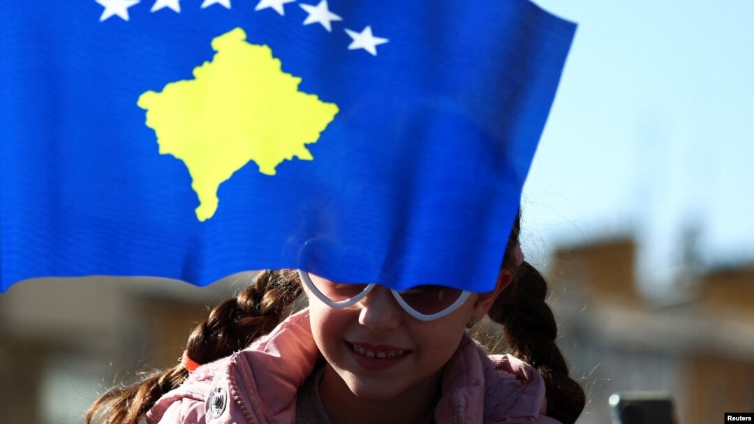 A child attends a parade during celebrations of the 15th anniversary of Kosovo independence in Pristina, Kosovo, Feb. 17, 2023.