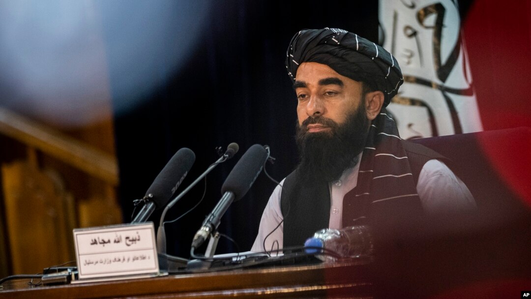 FILE - Taliban government spokesman Zabihullah Mujahid gives a press conference in Kabul, Afghanistan, Sept. 21, 2021. 