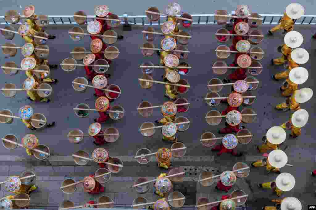 Shan ethnic people participate in a rehearsal in Panghsang, Myanmar, ahead of a military parade to celebrate 30 years of a ceasefire signed with the Myanmar military.