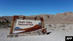 FILE - A view of the Death Valley National Park sign is seen in Death Valley, Calif., Feb. 14, 2017.