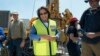 Cape Town City Mayor Patricia de Lille (C) talks to media at a site where the city council has ordered drilling into the aquifer to tap water, in Mitchells Plain, about 25km from the city center on Jan. 11, 2018 in Cape Town.