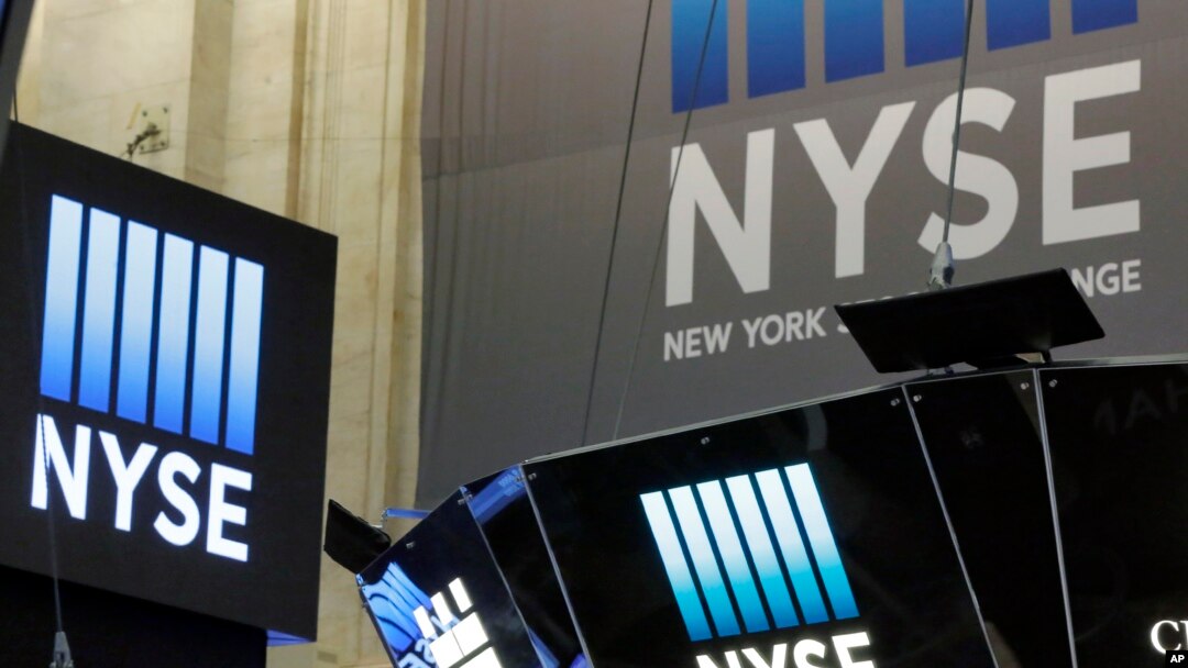The top of a trading post and an NYSE banner above the trading floor of the New York Stock Exchange are shown, Nov. 10, 2016.