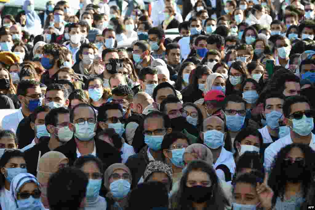 Tunisian doctors and medical students demand the dismissal of the minister of health during a protest after the death of a resident doctor who fell from a broken hospital elevator, in Tunisia. 