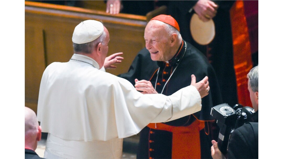 FILE - Pope Francis reaches out to hug Cardinal Archbishop emeritus Theodore McCarrick after the Midday Prayer of the Divine with more than 300 U.S. Bishops at the Cathedral of St. Matthew the Apostle in Washington, D.C., September 23, 2015.