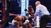 Moyi Grande-Bretagne Anthony Joshua (G) agumbami na makofi ya moyi Grande-Bretagne mosusu Daniel Dubois na bitumba ya ba poids lourds ya nkamba ya molongo ya IBF na etando ya masano ya Wembley, Londres, Sanza 21 2024. (Photo by Adrian Dennis / AFP) 
