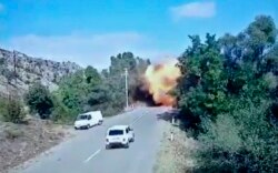 Alleged Azerbaijani armed forces shell civilian infrastructures in Stepanakert, in Nagorno-Krabakh on October 2, 2020. Armenian Foreign Ministry via AP.