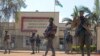 M23 rebels guard outside the South Kivu province administrative office, in the center of the eastern DRC's second-largest city, Bukavu, Feb. 16, 2025.