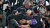 ญาติกอดตัวประกันชาวไทยที่ถูกปล่อยตัว ซึ่งถูกลักพาตัวระหว่างเหตุโจมตีโดยกลุ่มฮามาสเมื่อวันที่ 7 ต.ค. 2023 และถูกควบคุมตัวในฉนวนกาซา ขณะที่ตัวประกันเดินทางถึงไทยหลังจากได้รับการปล่อยตัว ที่สนามบินสุวรรณภูมิ เมื่อ 9 ก.พ. 2025 (REUTERS/Athit Perawongmetha)