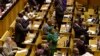 Members of the ruling African National Congress applaud as the results are read of a no-confidence vote by MP's in parliament in Cape Town South Africa, Aug. 8, 2017.