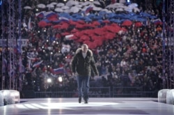 Russian President Vladimir Putin attends a concert marking the seventh anniversary of Russia's annexation of Crimea at Luzhniki Stadium in Moscow, Russia on March 18, 2021.