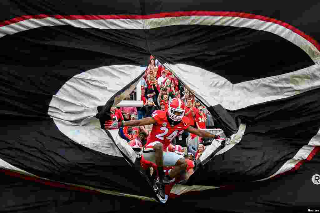 Nov 18, 2017; Athens, GA, USA; Georgia Bulldogs players lead by safety Dominick Sanders (24) run out on to the field prior to the game against the Kentucky Wildcats at Sanford Stadium. Mandatory Credit: Dale Zanine-USA TODAY Sports