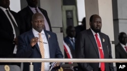 FILE - South Sudan's President Salva Kiir, right, and Vice President Riek Machar attend a Holy Mass led by Pope Francis at the John Garang Mausoleum in Juba, South Sudan, Feb. 5, 2023. 