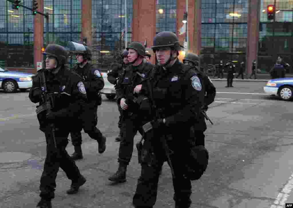 Police on School and Walnut Street as the search continues for a suspect on April 19, 2013 in Watertown.