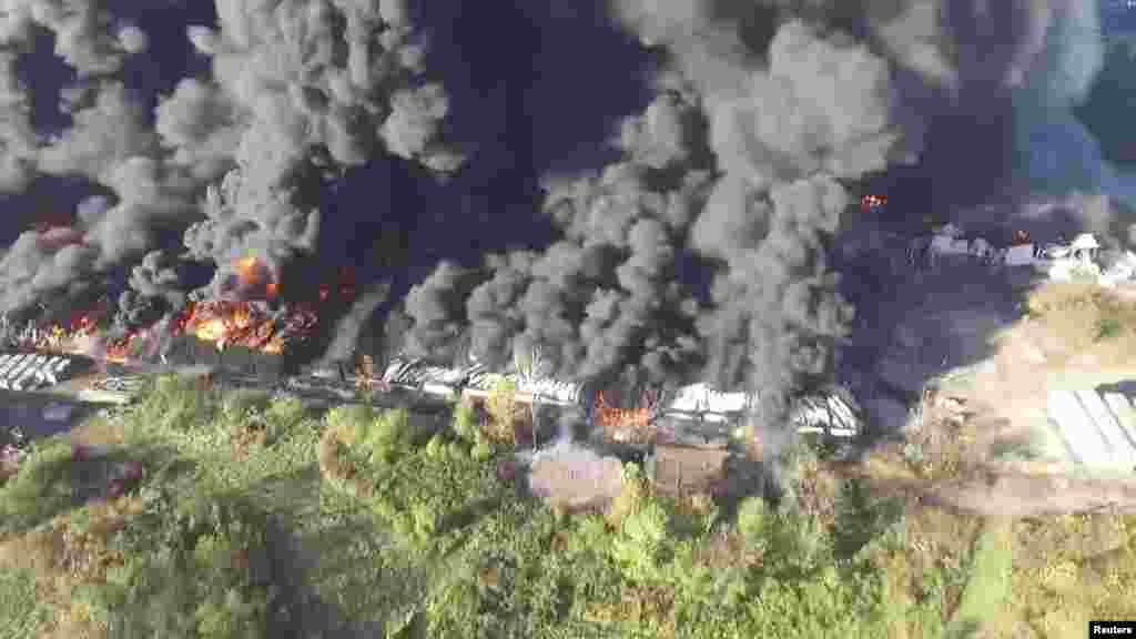 Smoke rises during a fire at a former tool plant in Parkersburg, West Virginia, in this still image taken from video obtained from social media, Oct. 21, 2017.