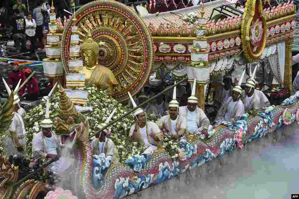 A golden statue of Buddha sits on a float during the Rab Bua (Lotus Receiving) festival to mark the end of Buddhist Lent in the central Thai province of Samut Prakan.