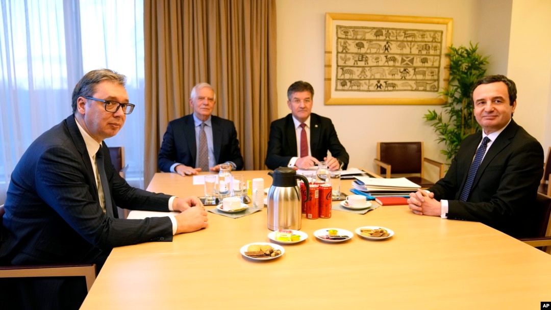 Serbian President Aleksandar Vucic, left, and Kosovo's Prime Minister Albin Kurti, right, meet with European Union foreign policy chief Josep Borrell, second left, in Brussels, Feb. 27, 2023. 